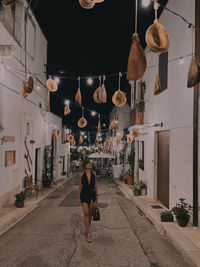 Rear view of woman walking in temple