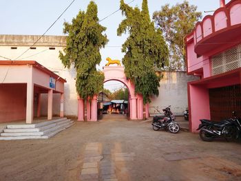 Street amidst trees and buildings in city