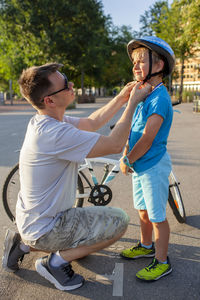 Side view of young woman exercising in workshop
