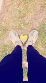 Low section of person standing on ground