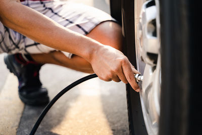 High angle view of man repairing car