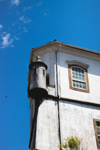 Low angle view of building against blue sky