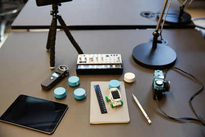 High angle view of various technologies on desk in office