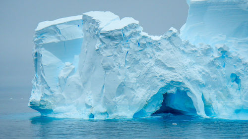 Scenic view of frozen sea against sky