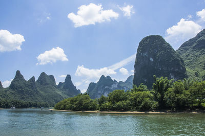 Scenic view of mountains against cloudy sky