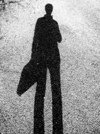Shadow of man standing on ground