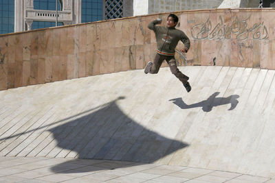 Full length of man skateboarding