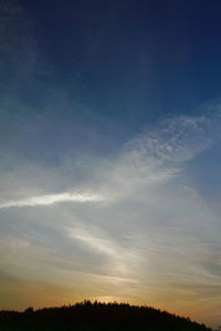 Scenic view of silhouette landscape against sky at sunset