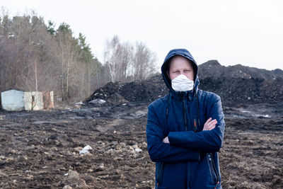 A guy stands in a mask