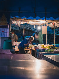 Man working at market stall