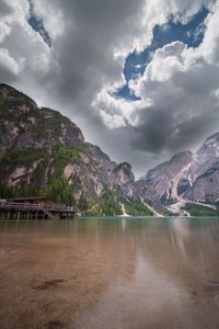 Scenic view of lake against cloudy sky