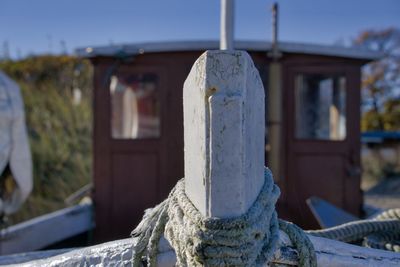 Close-up of old wooden posts in building