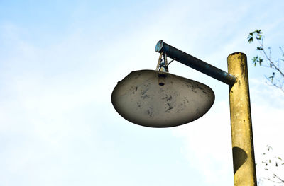 Low angle view of hanging against sky