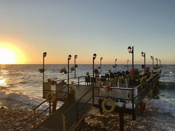 Scenic view of sea against clear sky during sunset