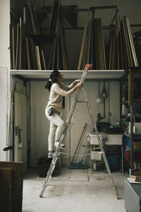 Rear view of man working at construction site