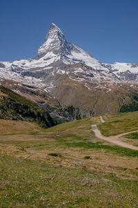 Scenic view of snowcapped mountain against sky