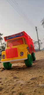 Close-up of toy car on sand