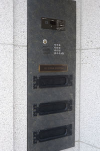 Close-up of mailbox on wall