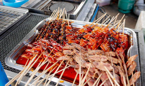 High angle view of meat on barbecue grill