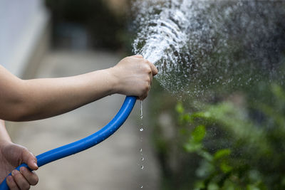 Close-up of hand holding water