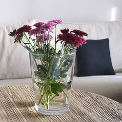 Close-up of flower vase on table at home