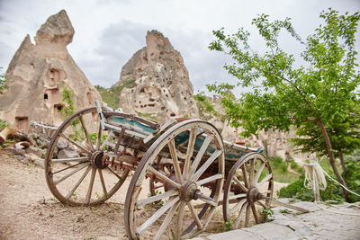 Old rusty wheel on rock