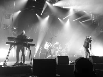 Panoramic view of music concert at night