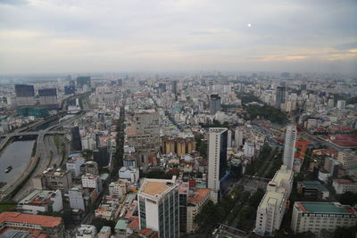 High angle view of city buildings against sky