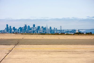 City skyline with sea in background