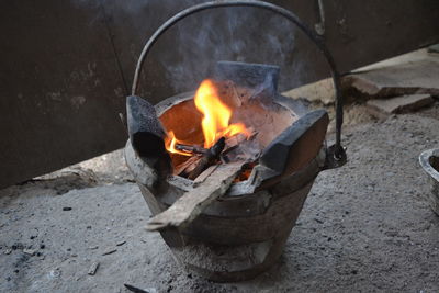 High angle view of burning fire on wood