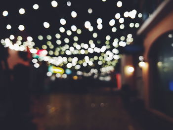 Defocused image of illuminated lights at night