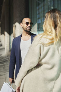 Friends talking in street