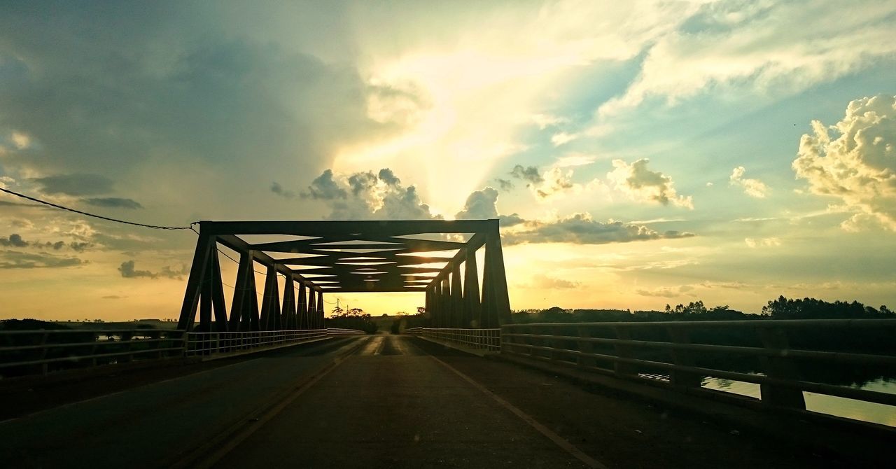 cloud - sky, sky, sunset, outdoors, architecture, sunlight, road, no people, dramatic sky, tree, built structure, nature, beauty in nature, bridge - man made structure, scenics, day