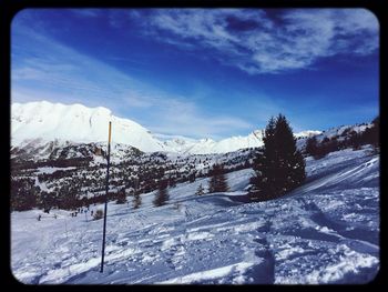 Scenic view of snow covered mountains
