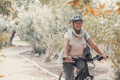 Side view of man riding bicycle