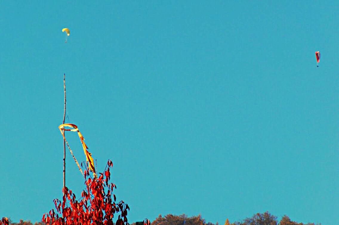 VIEW OF FERRIS WHEEL AGAINST BLUE SKY