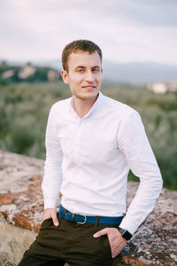 Portrait of man standing outdoors