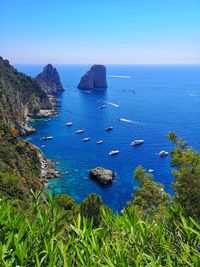 Scenic view of sea against clear blue sky