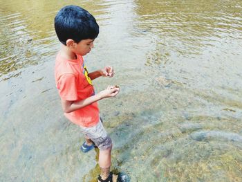 Full length of baby boy in water