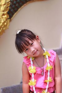 Portrait of smiling girl wearing garland