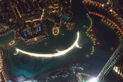 High angle view of illuminated buildings in city at night