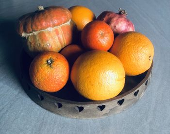 High angle view of fruits in basket on table