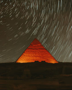 Great pyramid of giza in egypt against the starry night sky