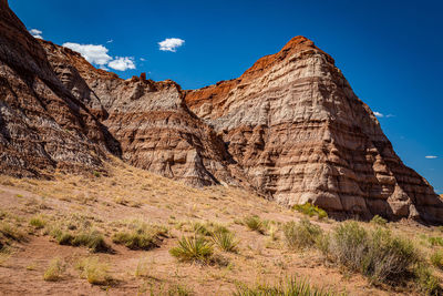 Rock formations on landscape against sky