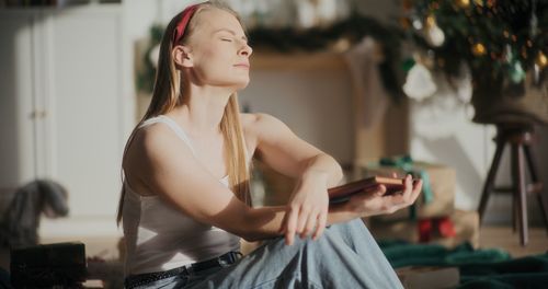 Portrait of young woman using mobile phone