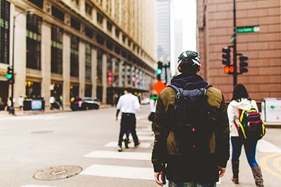 Rear view of people crossing street in chicago