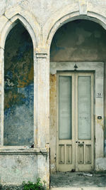 Arches door and time entrance to an old building 