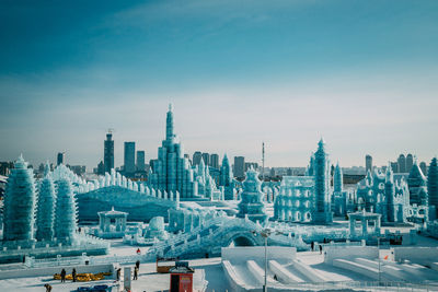 Panoramic view of buildings in city against sky