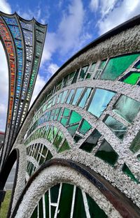 Low angle view of glass sculpture against sky