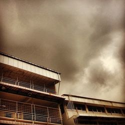 Low angle view of built structure against cloudy sky